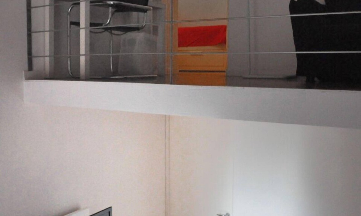 Rione XVIII Castro Pretorio Apartment | Rome: Sleeping space and living room - two levels between Repubbli