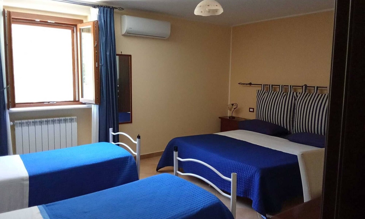 Castelforte Apartment | Room 'Quadrupla' with Shared Pool, Wi-Fi and Air Conditioning