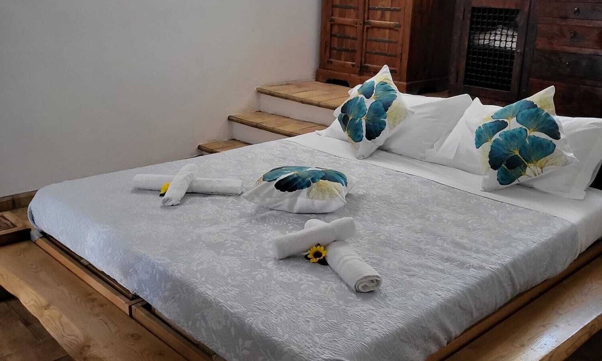 Campagnano di Roma Apartment | Rustic Elegance at Two Steps from Rome: Relaxation among Exposed Beams and Cotto