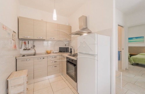 Marina di Campo Apartment | Albero del Pepe 2 with lush garden