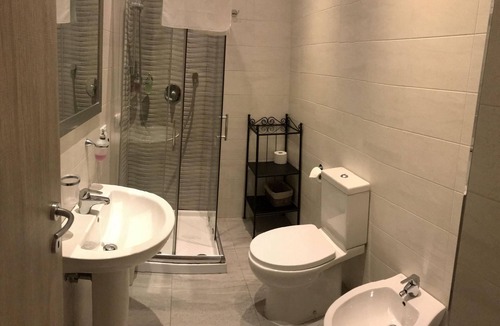 Esquilino Bed & Breakfast | Aria Rome Rooms quadruple room with balcony overlooking Basilica di San Giovanni