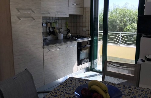 Brancaleone Apartment | Beachfront apartment in prime position with rooftop terrace, balcony and patio.