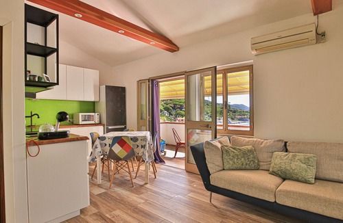 Seccheto Apartment | Camilla, a three-room apartment in Seccheto with a splendid sea view, a small balcony equipped with