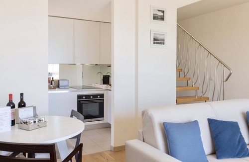 Scarlino Apartment | Elegant and spacious three-room apartment with frontal sea view characterized by an elegant and refined design of approximately 100 m2 and arranged on two levels.On the first floor it is composed of a living room with double sofa bed and fully equipped i