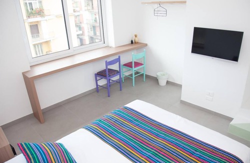 Fuorigrotta Apartment | Green apartment with double bedroom and living room / kitchen with sofa bed and private bathroom