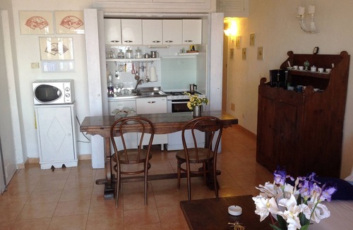 Cala Piccola Apartment | House with large terrace overlooking the sea, swimming pool, solarium, bathing establishment.