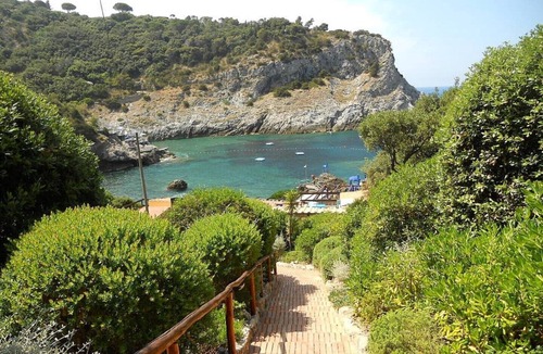 Cala Piccola Apartment | House with large terrace overlooking the sea, swimming pool, solarium, bathing establishment.