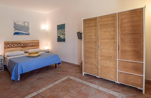 Sant'Angelo House | Inviting cottage with charming outdoor area and limited sea view.