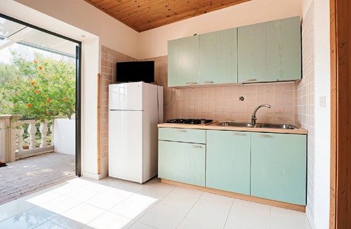 Chiesiola Resort | Property in a Holiday Village 'Baia Falcone - Comfort 210' with Sea View and Air Conditioning