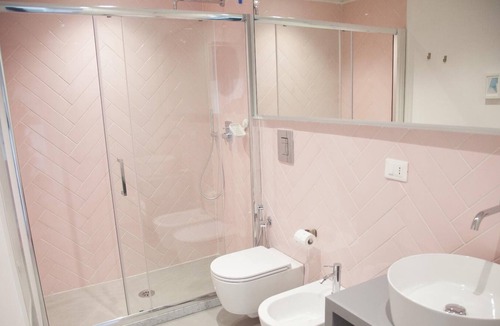 Fuorigrotta Apartment | Rosa apartment with double bedroom and living room / kitchen with sofa bed and private bathroom