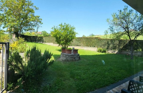 Campagnano di Roma Apartment | Rustic Elegance at Two Steps from Rome: Relaxation among Exposed Beams and Cotto