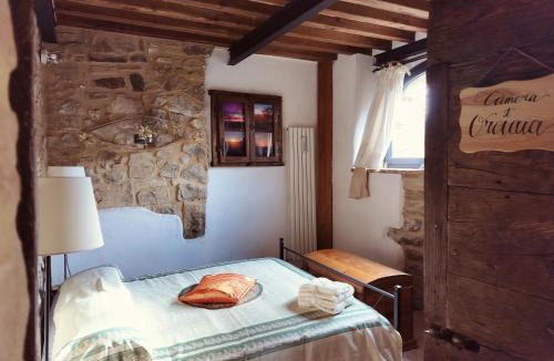 Castel del Piano House | Vecchio Casale Quercetino Stone Room in Historic Tuscan Estate with Pool 2p