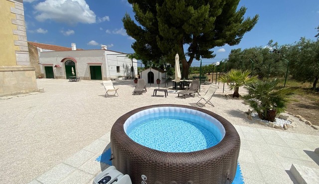 Renovated old farmhouse among olive trees and vineyards with outdoor hot tub