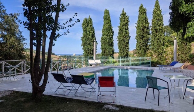 Seafront Villa Surrounded By Hill Full Of Trees