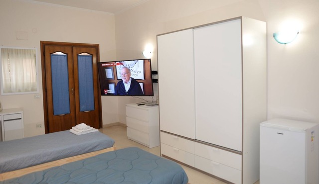 TRIPLE ROOM WITH BALCONY AND SAMSUNG TV LATEST GENERATION