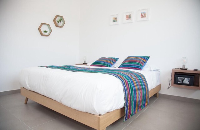 Green apartment with double bedroom and living room / kitchen with sofa bed and private bathroom