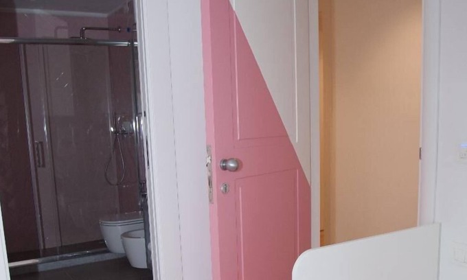 Fuorigrotta Apartment | Rosa apartment with double bedroom and living room / kitchen with sofa bed and private bathroom